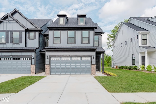 9751 Behner Dr, Fishers, IN 46250 - view of front of property with brick siding, an attached garage, board and batten siding, and concrete driveway