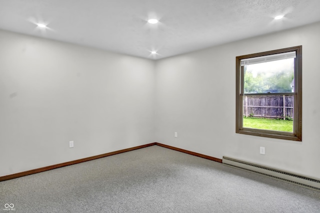 168 Midway Ct S, Hope, IN 47246 - spare room featuring a baseboard radiator, carpet floors, and recessed lighting