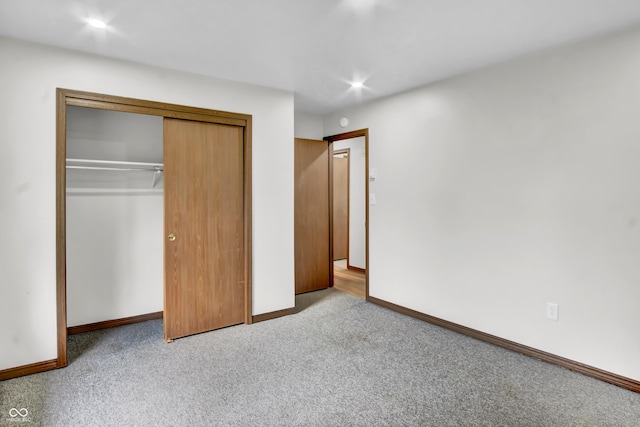 168 Midway Ct S, Hope, IN 47246 - unfurnished bedroom featuring carpet, a closet, and recessed lighting