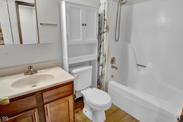 168 Midway Ct S, Hope, IN 47246 - full bathroom featuring vanity, shower / tub combo, and wood finished floors