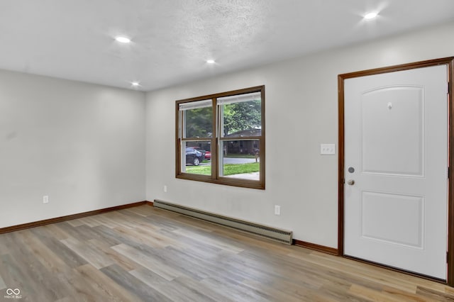 168 Midway Ct S, Hope, IN 47246 - entryway featuring a baseboard radiator, light wood-style floors, and recessed lighting