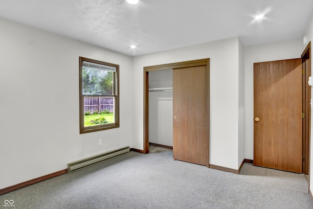 168 Midway Ct S, Hope, IN 47246 - unfurnished bedroom featuring a baseboard radiator, carpet flooring, a closet, and recessed lighting