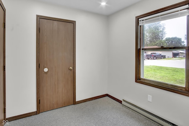 168 Midway Ct S, Hope, IN 47246 - unfurnished bedroom with baseboard heating, light carpet, and a closet