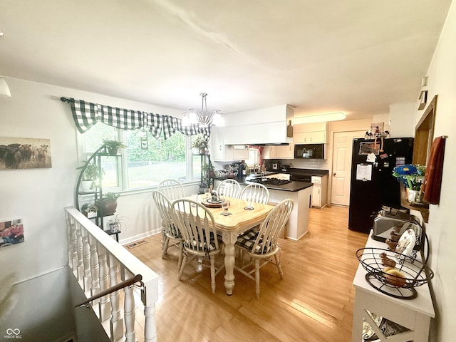 2615 Alexandria Pike, Anderson, IN 46012 - dining room with light wood-type flooring and a chandelier