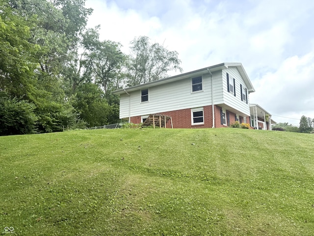 2615 Alexandria Pike, Anderson, IN 46012 - back of house featuring a lawn