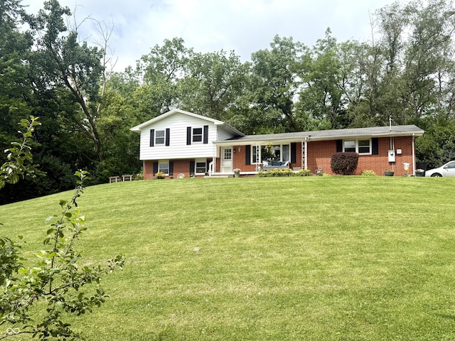 2615 Alexandria Pike, Anderson, IN 46012 - tri-level home with brick siding, covered porch, and a front lawn