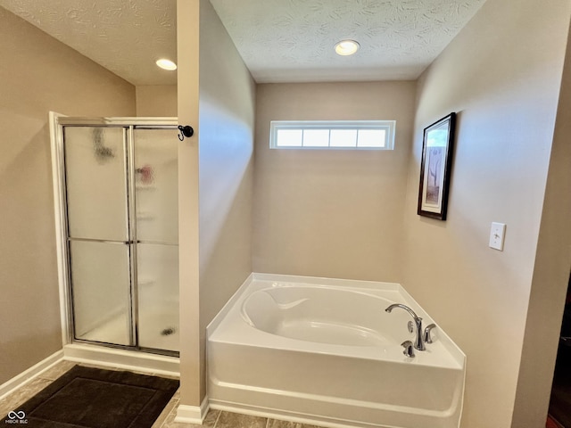 13859 Keams Dr, Fishers, IN 46038 - full bath with a shower stall, a textured ceiling, a garden tub, and recessed lighting