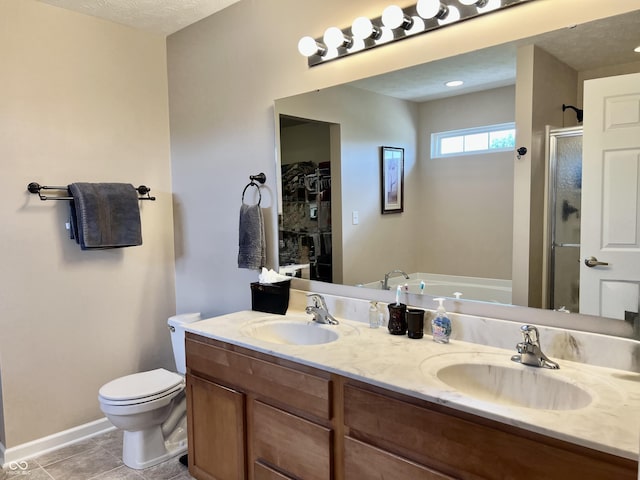 13859 Keams Dr, Fishers, IN 46038 - bathroom featuring a shower stall, a garden tub, double vanity, and tile patterned flooring