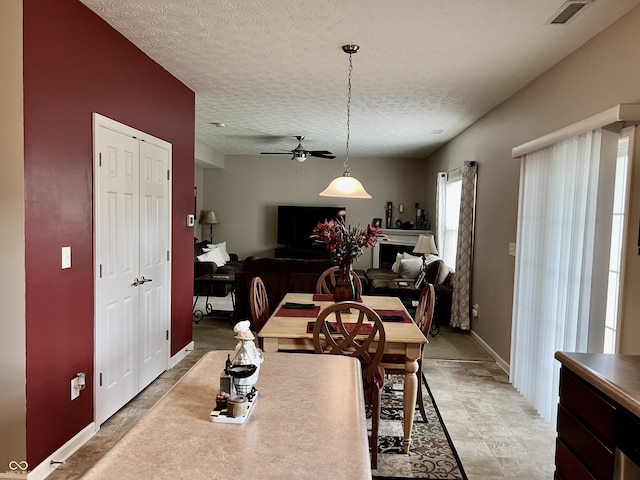 13859 Keams Dr, Fishers, IN 46038 - dining space featuring a ceiling fan and a textured ceiling