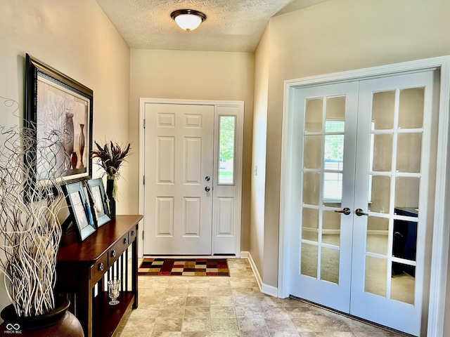 13859 Keams Dr, Fishers, IN 46038 - foyer entrance featuring french doors and a textured ceiling