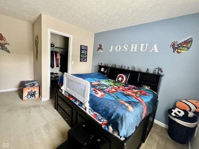 13859 Keams Dr, Fishers, IN 46038 - bedroom featuring carpet flooring, a walk in closet, a closet, and a textured ceiling