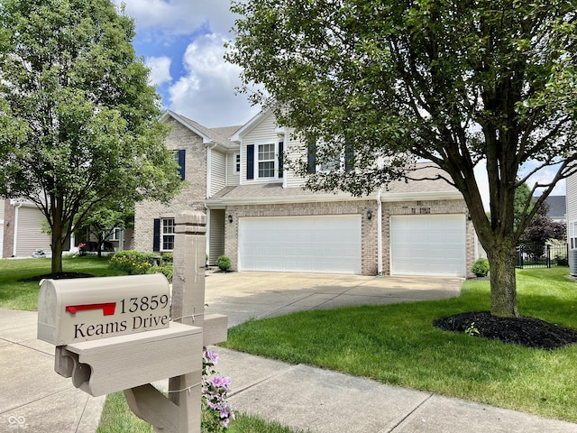 13859 Keams Dr, Fishers, IN 46038 - view of front facade with concrete driveway, an attached garage, a front lawn, and brick siding
