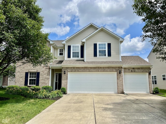 13859 Keams Dr, Fishers, IN 46038 - view of front of home featuring brick siding, concrete driveway, a garage, and roof with shingles