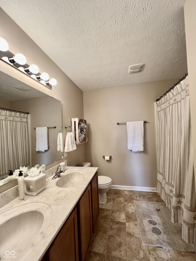 13859 Keams Dr, Fishers, IN 46038 - full bath featuring double vanity, a textured ceiling, stone finish floors, and curtained shower