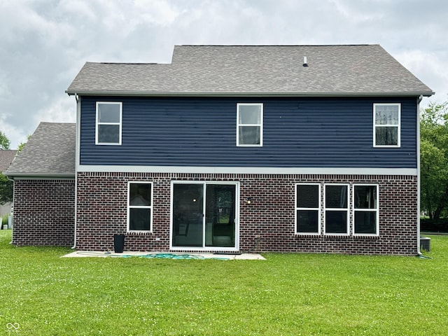 980 S Raylee Garden Dr, New Palestine, IN 46163 - rear view of property featuring a yard, brick siding, and a shingled roof