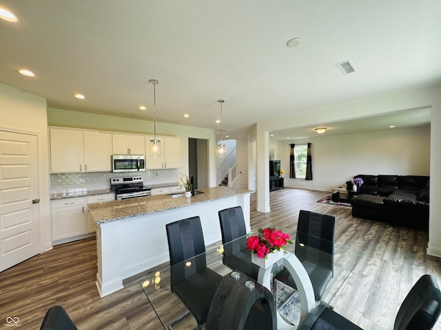 980 S Raylee Garden Dr, New Palestine, IN 46163 - dining space featuring stairs, dark wood-type flooring, and recessed lighting