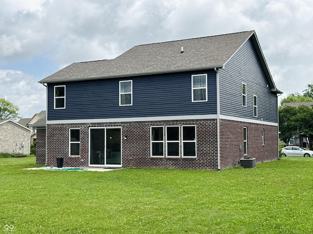 980 S Raylee Garden Dr, New Palestine, IN 46163 - rear view of house featuring brick siding, a lawn, and roof with shingles