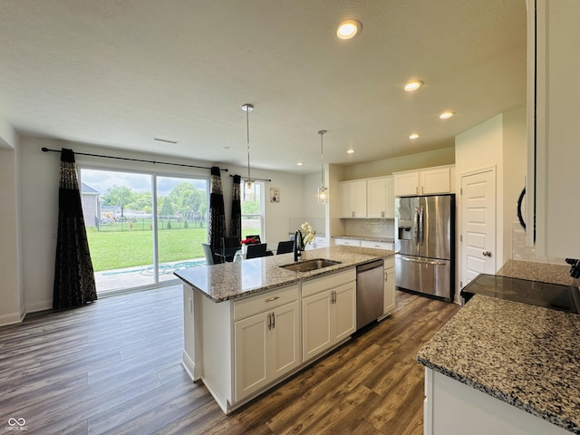 980 S Raylee Garden Dr, New Palestine, IN 46163 - kitchen featuring stainless steel appliances, dark wood-style flooring, a kitchen island with sink, white cabinets, and recessed lighting