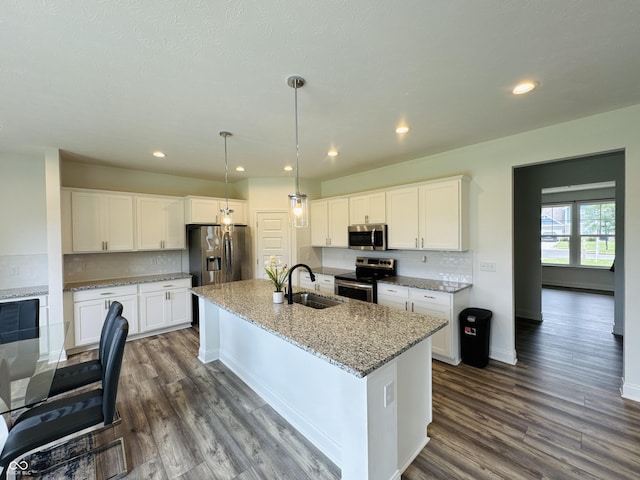 980 S Raylee Garden Dr, New Palestine, IN 46163 - kitchen with stainless steel appliances, dark wood-style floors, white cabinets, and recessed lighting