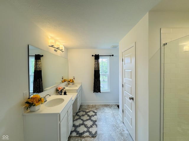 980 S Raylee Garden Dr, New Palestine, IN 46163 - full bath featuring double vanity, tiled shower, and a textured ceiling