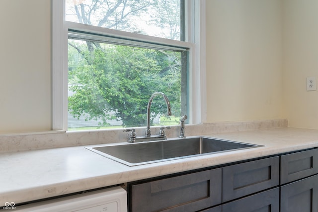 321 W Broad St, Spiceland, IN 47385 - kitchen with gray cabinets, dishwashing machine, healthy amount of natural light, and light countertops