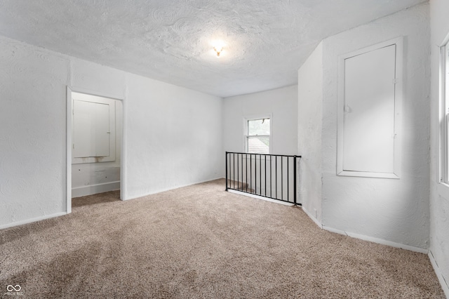 321 W Broad St, Spiceland, IN 47385 - carpeted spare room with a textured ceiling and a textured wall