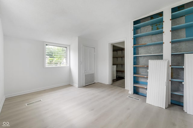 321 W Broad St, Spiceland, IN 47385 - unfurnished bedroom with wood finished floors and vaulted ceiling