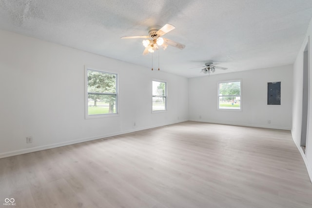 321 W Broad St, Spiceland, IN 47385 - spare room with light wood-type flooring, ceiling fan, and a textured ceiling