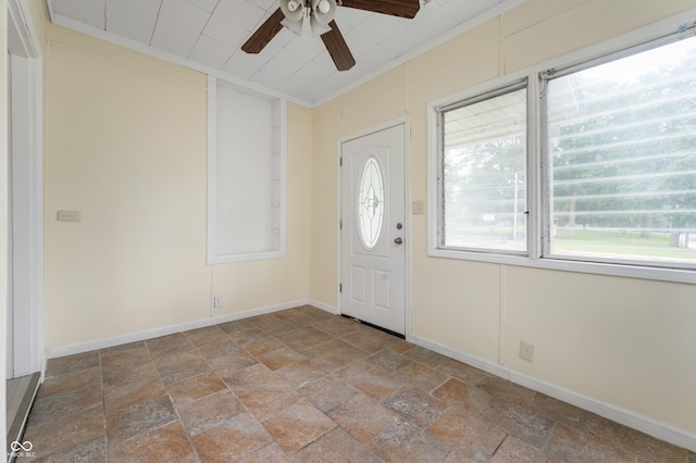 321 W Broad St, Spiceland, IN 47385 - foyer with a ceiling fan, stone finish floors, and ornamental molding