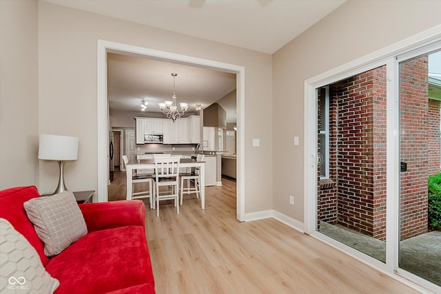11074 Galley Way, Fishers, IN 46040 - living room featuring light wood-type flooring and a chandelier