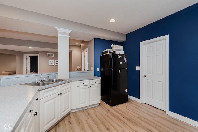 11074 Galley Way, Fishers, IN 46040 - kitchen with freestanding refrigerator, light wood finished floors, white cabinetry, light countertops, and recessed lighting