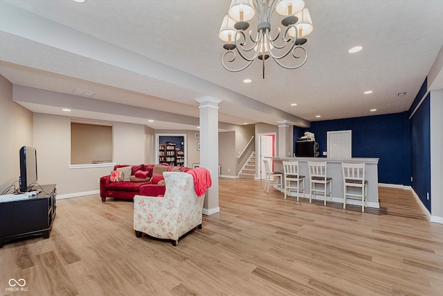 11074 Galley Way, Fishers, IN 46040 - living area with light wood finished floors, recessed lighting, stairway, decorative columns, and a chandelier