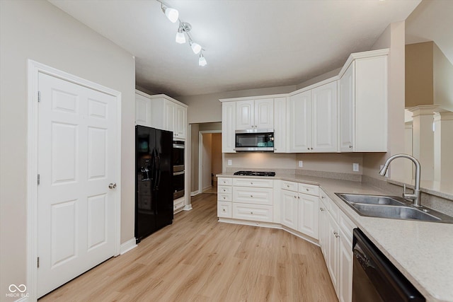 11074 Galley Way, Fishers, IN 46040 - kitchen with black appliances, white cabinetry, and light wood-style floors
