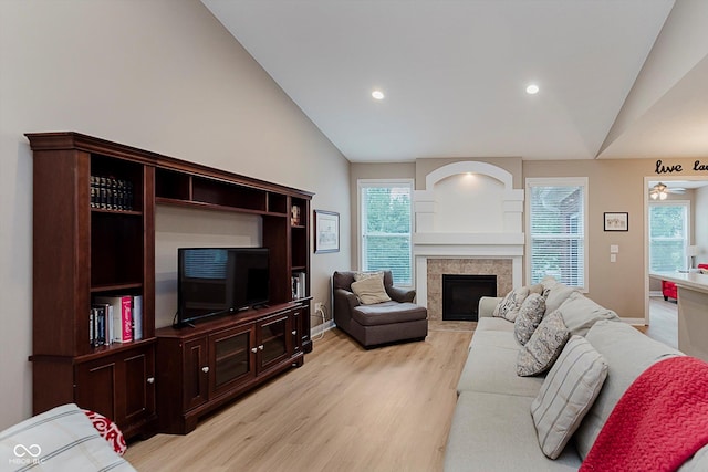 11074 Galley Way, Fishers, IN 46040 - living room with lofted ceiling, light wood-style flooring, plenty of natural light, recessed lighting, and a fireplace