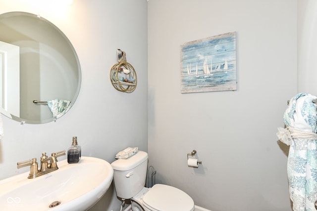 9053 Fitzgerald Dr, Indianapolis, IN 46239 - half bathroom featuring a sink and toilet