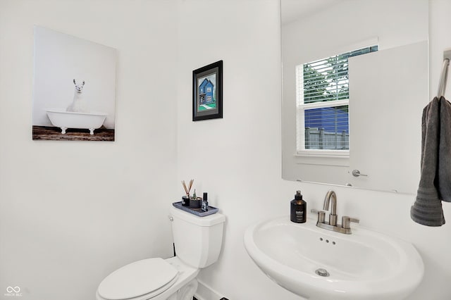 2720 Guilford Ave, Indianapolis, IN 46205 - bathroom featuring a sink and toilet