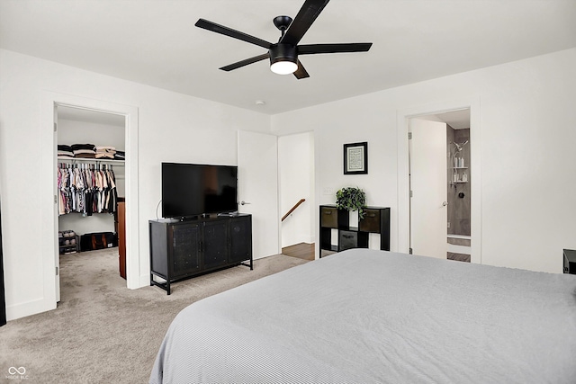 2720 Guilford Ave, Indianapolis, IN 46205 - bedroom with carpet, a spacious closet, a ceiling fan, connected bathroom, and a closet