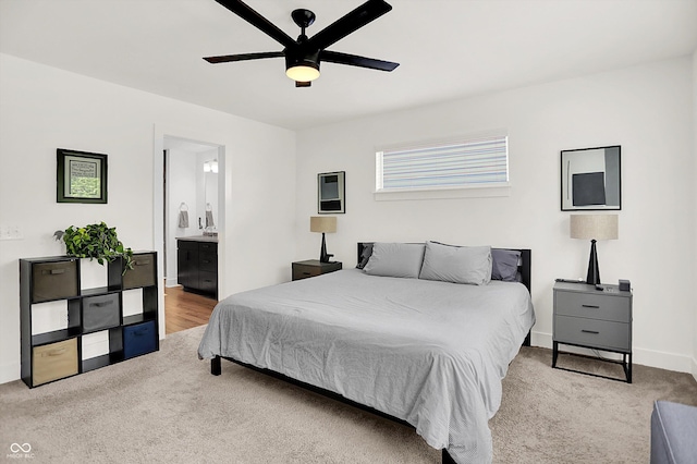 2720 Guilford Ave, Indianapolis, IN 46205 - carpeted bedroom featuring connected bathroom and ceiling fan