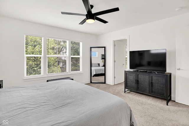 2720 Guilford Ave, Indianapolis, IN 46205 - bedroom featuring light colored carpet and a ceiling fan