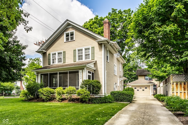 4904 N Washington Blvd, Indianapolis, IN 46205 - american foursquare style home with an outdoor structure, a sunroom, a chimney, and a garage