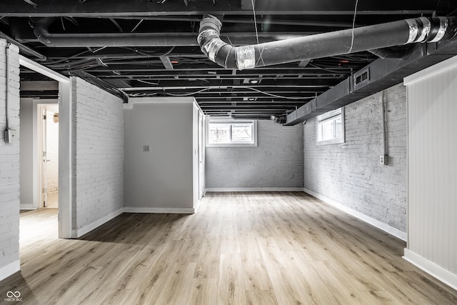 4904 N Washington Blvd, Indianapolis, IN 46205 - basement with brick wall and wood finished floors