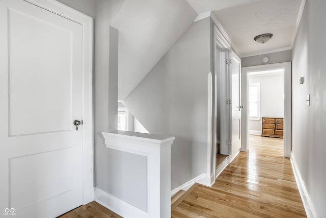 4904 N Washington Blvd, Indianapolis, IN 46205 - corridor with light wood-style flooring, an upstairs landing, and ornamental molding