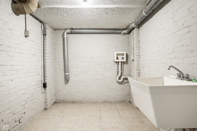 4904 N Washington Blvd, Indianapolis, IN 46205 - basement featuring brick wall and light tile patterned floors