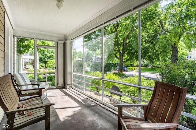 4904 N Washington Blvd, Indianapolis, IN 46205 - unfurnished sunroom featuring crown molding