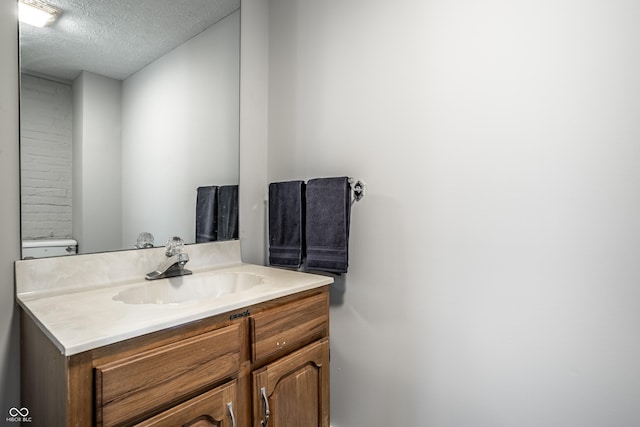 4904 N Washington Blvd, Indianapolis, IN 46205 - bathroom featuring vanity and a textured ceiling