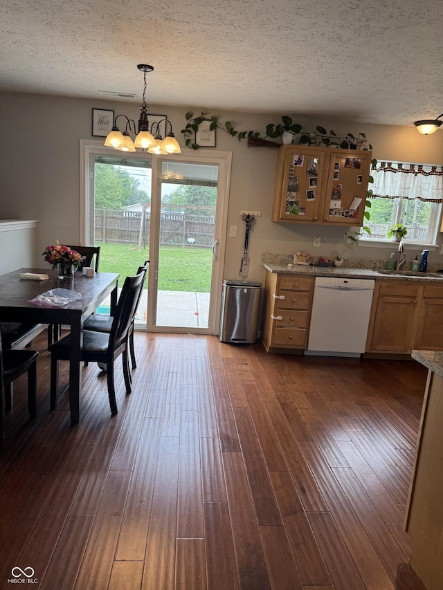 6027 Moonseed Cir, Indianapolis, IN 46203 - kitchen with white dishwasher, a textured ceiling, a chandelier, healthy amount of natural light, and hanging light fixtures