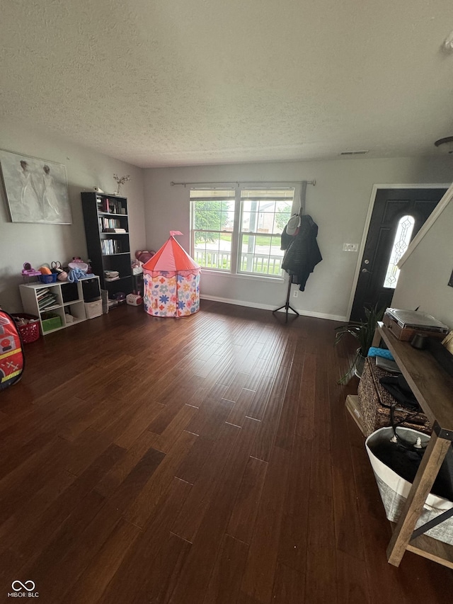 6027 Moonseed Cir, Indianapolis, IN 46203 - playroom featuring a textured ceiling and wood finished floors