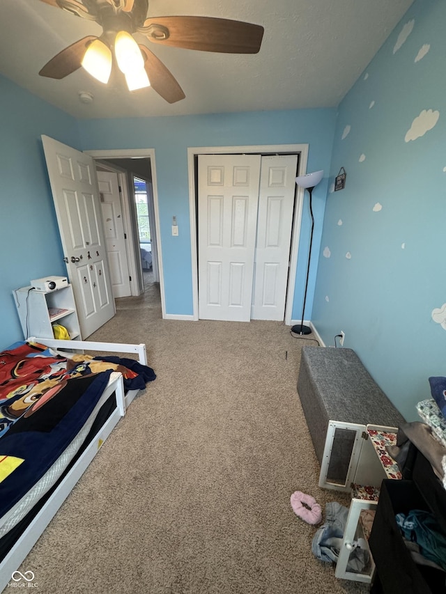 6027 Moonseed Cir, Indianapolis, IN 46203 - carpeted bedroom with a closet and ceiling fan