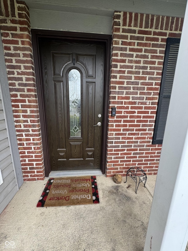 6027 Moonseed Cir, Indianapolis, IN 46203 - doorway to property with brick siding