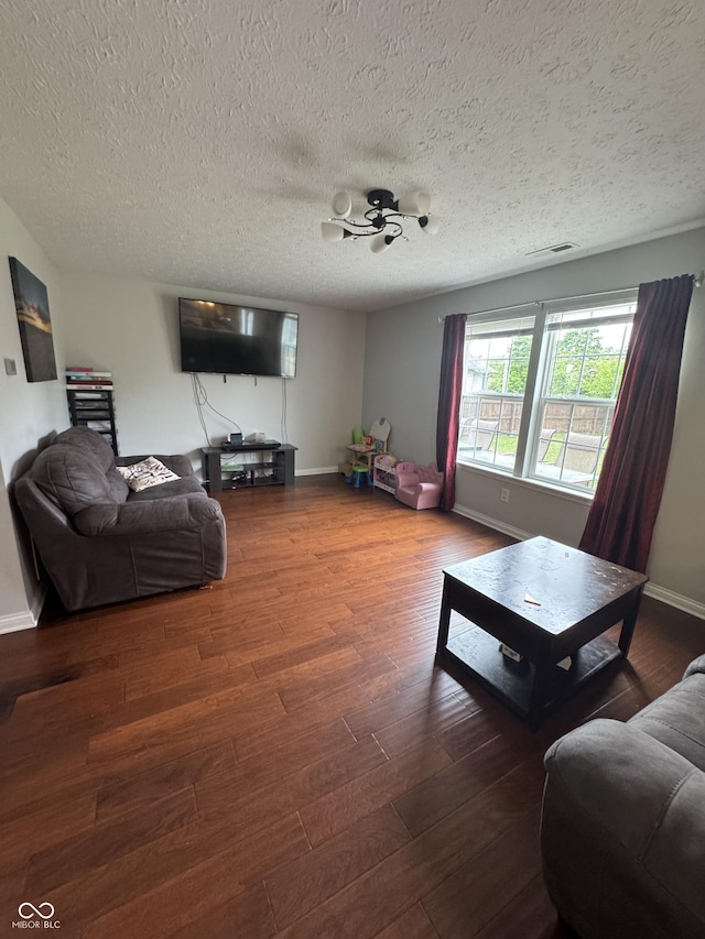 6027 Moonseed Cir, Indianapolis, IN 46203 - living area featuring wood finished floors and a textured ceiling